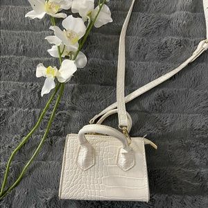 White crocodile embossed mini crossbody bag